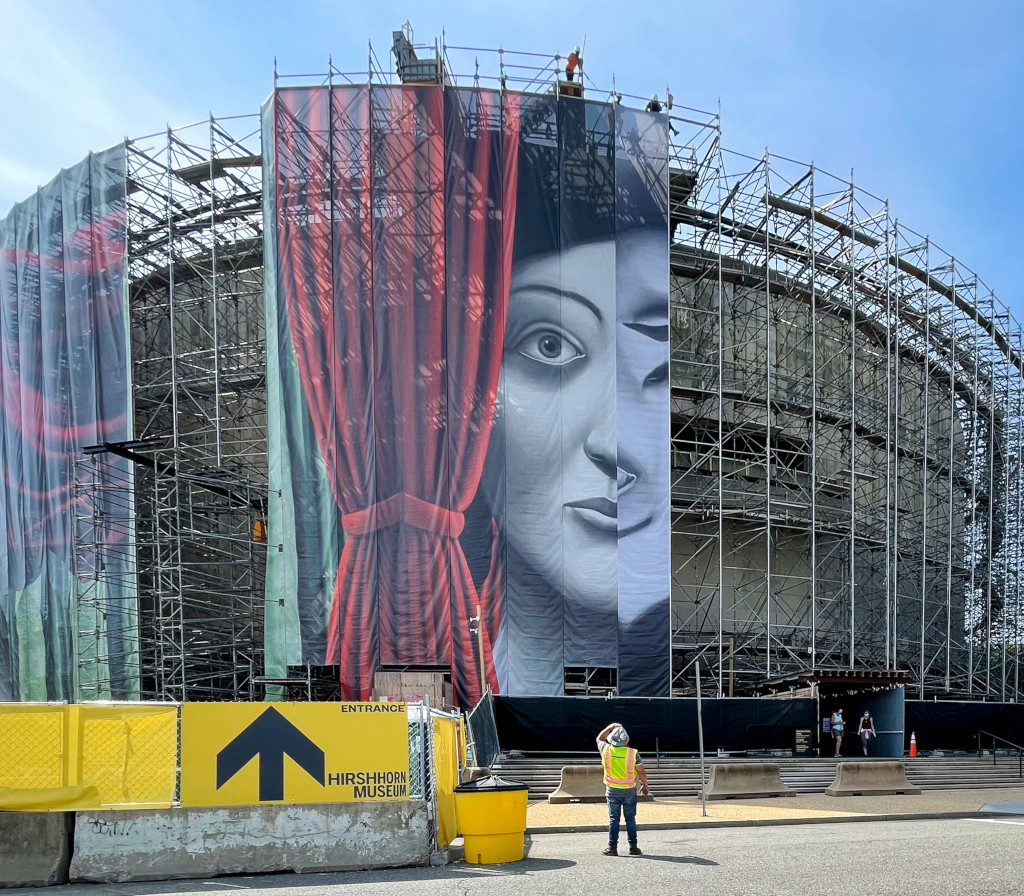 Installation of Draw the Curtain, an artwork by Nicolas Party, spanning the exterior of the Hirshhorn Museum